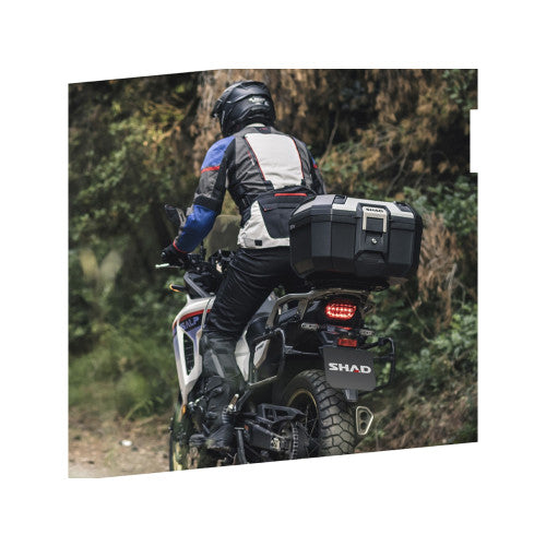 SHAD TR46 Top Box Aluminium fitted to an off-road motorcycle, rear riding view