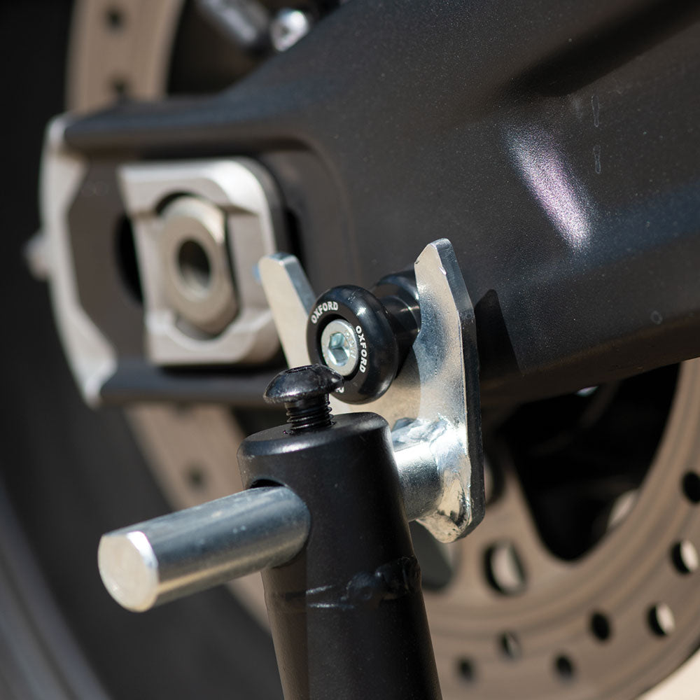 Oxford M6 Bobbins Black - 1.0 Thread, fitted to a motorcycle swingarm