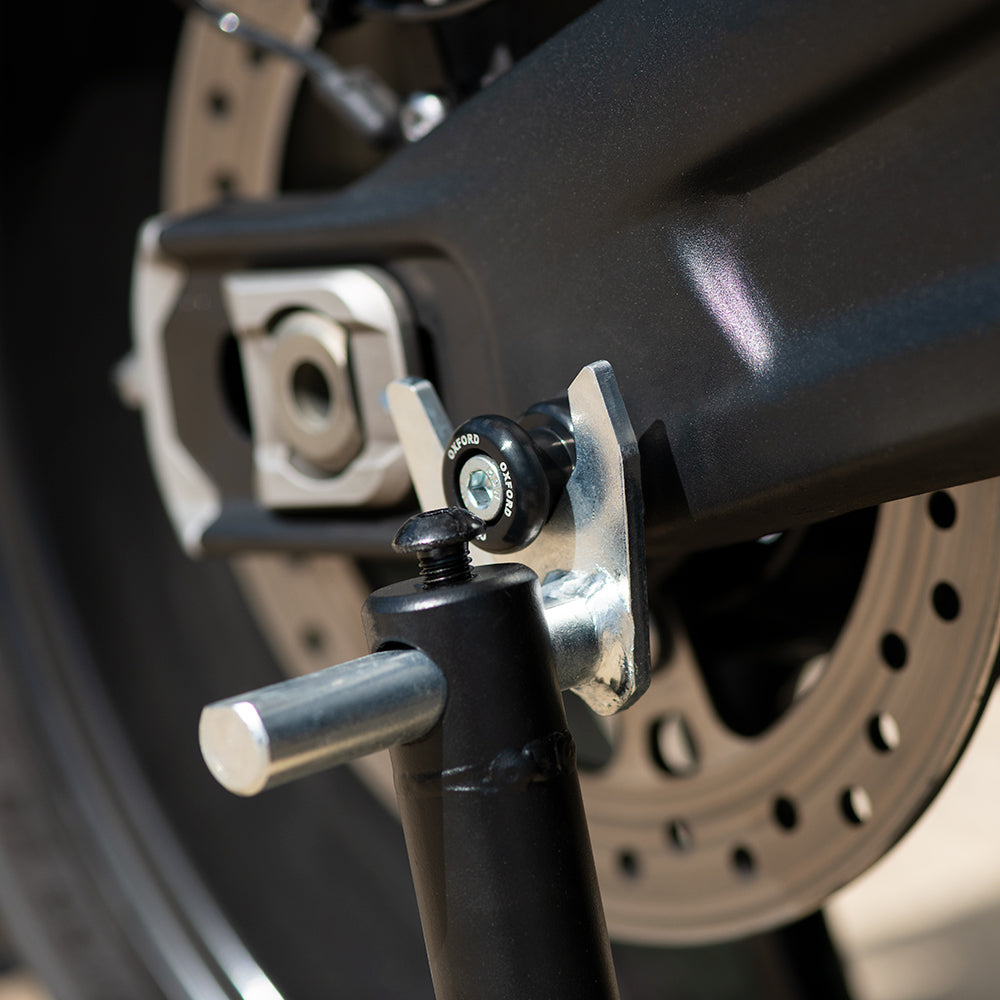 Oxford M8 Bobbins Black - 1.0 Thread, fitted to a motorcycle swingarm