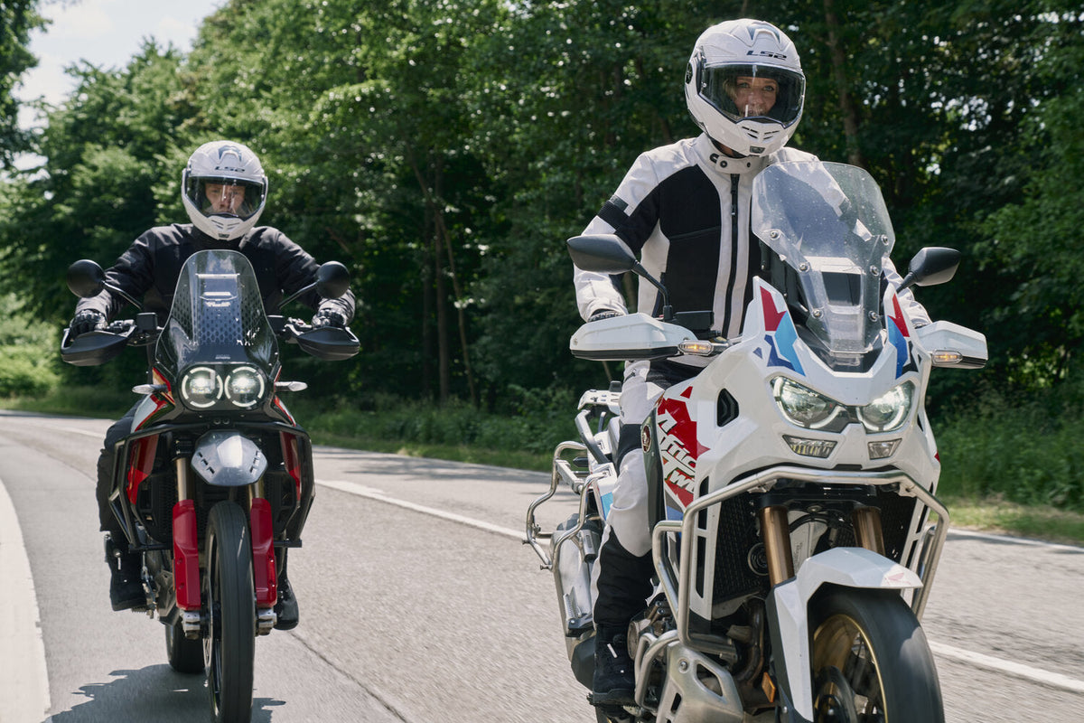 Richa Airstream X-2 Ladies Textile Jacket Black, worn by a rider in a two-motorcycle road scene