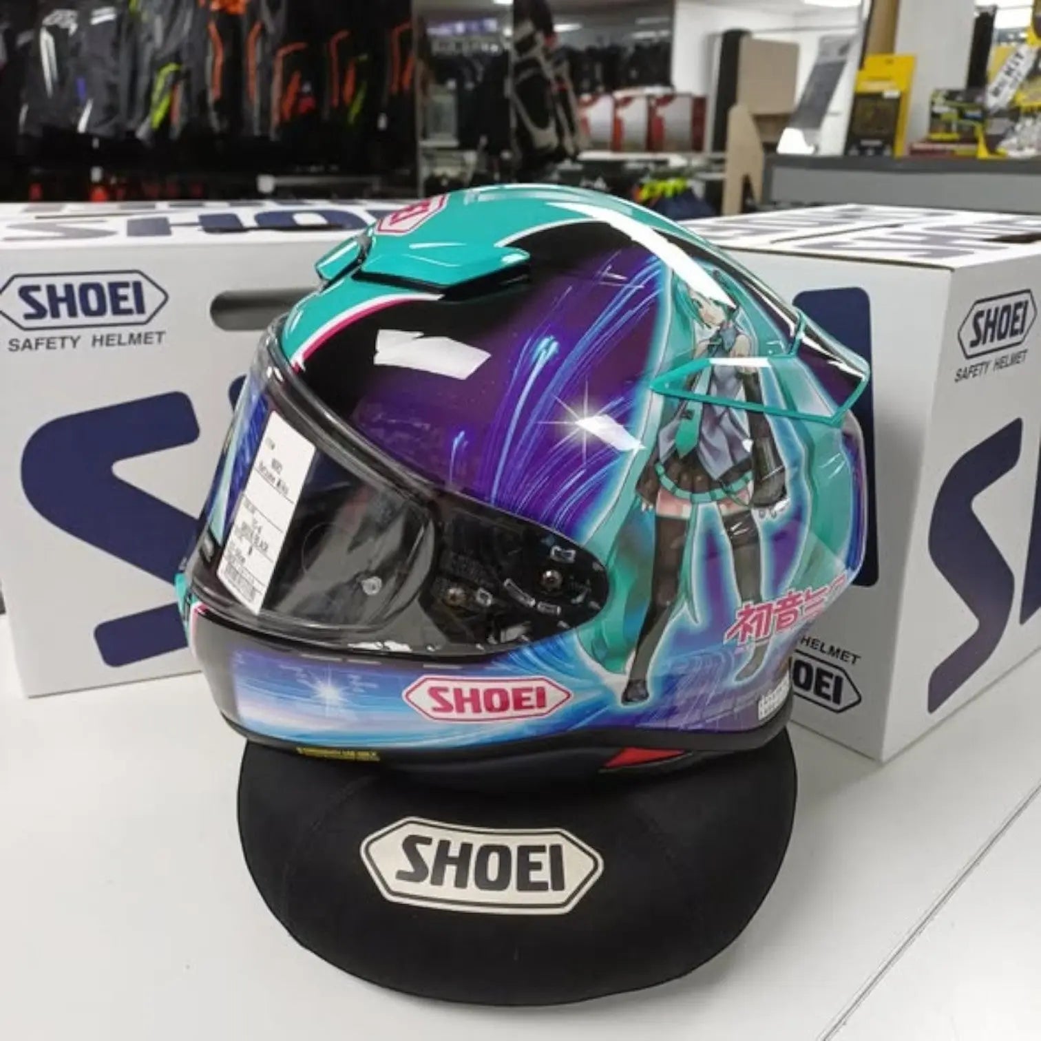 Stand-Out-On-The-Road-With-The-Shoei-NXR2-Hatsune-Miku-TC-4-Green-Only-At-Moto-Central - FREE UK Shipping, FREE 365 Day Returns | Moto Central