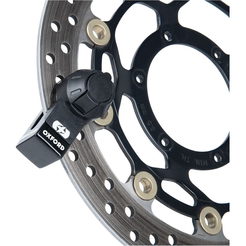 Oxford Mini T Disc Lock Black, fitted to a motorcycle brake disc